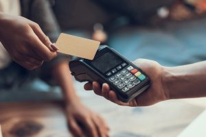 Close up of easy payment by credit card indoors