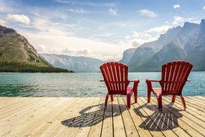 Jetty with chairs by Minnewanka Lake, Banff National Park, Alberta, Canada